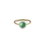 Gold ring with round green jade centrepiece, haloed by white crystals, slim band, elegant and timeless jewellery design.