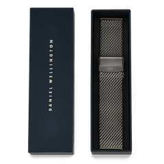 Daniel Wellington Graphite Mesh Strap with a graphite PVD finish, presented in a signature navy gift box, showcasing its elegant stainless steel mesh and folded clasp.