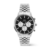 Stainless steel Daniel Wellington chronograph watch featuring a black "Panda" dial with silver sub-dials, luminous indexes, and a polished 5-link silver bracelet.