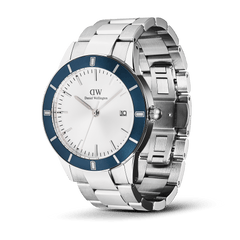 Daniel Wellington Iconic Paradigma Link Blue Bezel men’s watch with a brushed and polished stainless steel bracelet, bold blue aluminium bezel, and a crisp white dial featuring minimalist index markers and a date window.