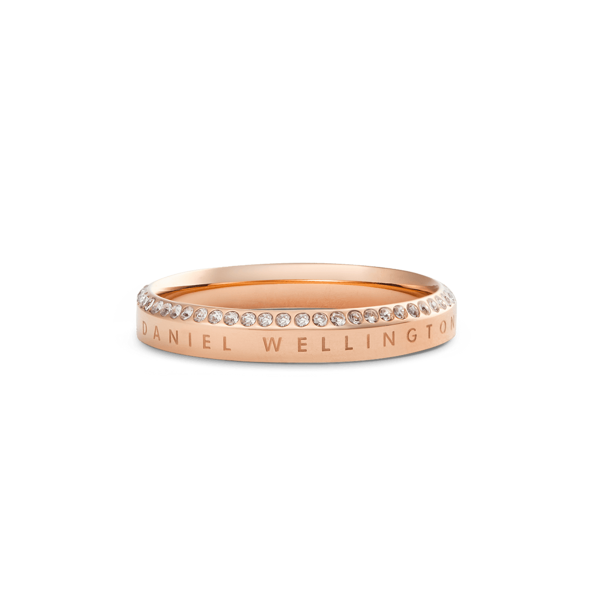 Classic Aura Ring Rose Gold featuring a slim rose gold band with Daniel Wellington engraving and a row of white cubic zirconia crystals along the chamfered edge, offering a refined, minimalist look.