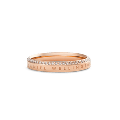 Classic Aura Ring Rose Gold featuring a slim rose gold band with Daniel Wellington engraving and a row of white cubic zirconia crystals along the chamfered edge, offering a refined, minimalist look.