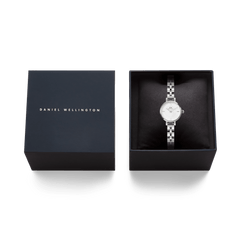 Daniel Wellington Petite Mini Arch 3-link White Silver watch presented in an elegant black gift box, showcasing its polished stainless steel bracelet and minimalist white dial.