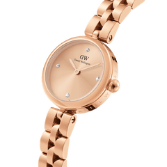 Elan Lumine Unitone Rose Gold women’s watch with a polished rose gold case, minimalist dial featuring four crystal hour markers, and a sleek three-link bracelet.