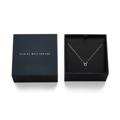 Crystal Zodiac Chain Necklace Gold with a sparkling Taurus pendant, elegantly displayed in a Daniel Wellington gift box.