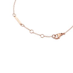 Close-up of the Crystal Zodiac Chain Bracelet Rose Gold showing the adjustable sizing rings, lobster clasp, and engraved Daniel Wellington tag.