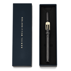 Pressed Sheffield Strap Gold presented in an elegant navy Daniel Wellington box, featuring a slim black leather watch strap with a polished gold buckle engraved with the brand’s initials.