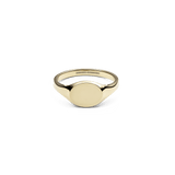Polished gold-tone mini signet ring with a smooth, flat oval face and minimalist design, crafted from stainless steel with a warm PVD gold finish.