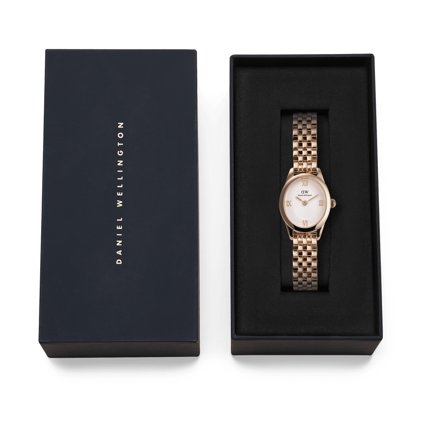 Ophelia Mini Rose Gold women’s watch with an oval case and polished rose gold bracelet, elegantly presented in a black Daniel Wellington gift box.
