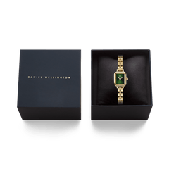 Quadro Mini Arch 3-link Emerald Sunray Gold watch displayed in an elegant black presentation box, highlighting its gold-tone rectangular case and emerald green sunray dial, ideal for gifting.