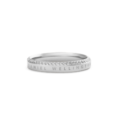 Classic Aura Ring Silver by Daniel Wellington, featuring a polished stainless steel band with a row of white cubic zirconia crystals along the chamfered edge and subtle engraved branding.