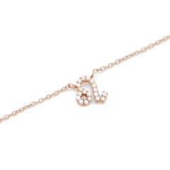 Rose gold chain necklace featuring a Leo zodiac pendant adorned with hand-set sparkling crystals.