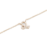 Gold chain necklace with a Leo zodiac pendant, detailed with hand-set sparkling crystals.