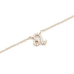 Gold chain necklace with a Leo zodiac pendant, detailed with hand-set sparkling crystals.