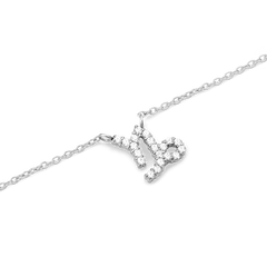 Silver chain necklace featuring a Capricorn zodiac pendant adorned with hand-set sparkling crystals.