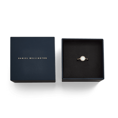 Audrey Ring in mother of pearl rose gold, presented in a navy Daniel Wellington gift box, elegant jewellery packaging.
