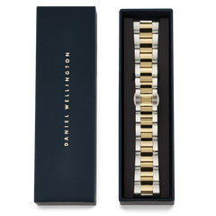 Daniel Wellington Smartwatch Iconic Link two-tone strap, featuring polished gold and brushed silver stainless steel links, elegantly presented in a signature navy gift box.
