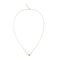 Delicate gold chain necklace featuring a small turquoise blue December birthstone charm set in gold-plated stainless steel.