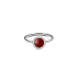 Silver ring with round red agate centre, pavé cubic zirconia halo, slim band; elegant modern jewellery style.