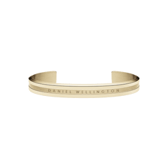Polished gold-tone Daniel Wellington Elan Bracelet featuring a minimalist open cuff design with engraved branding and a smooth, refined finish.