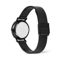 Rear view of the Daniel Wellington Petite Reflection Black watch, showing the engraved stainless steel case back, adjustable black mesh strap, and secure clasp buckle.