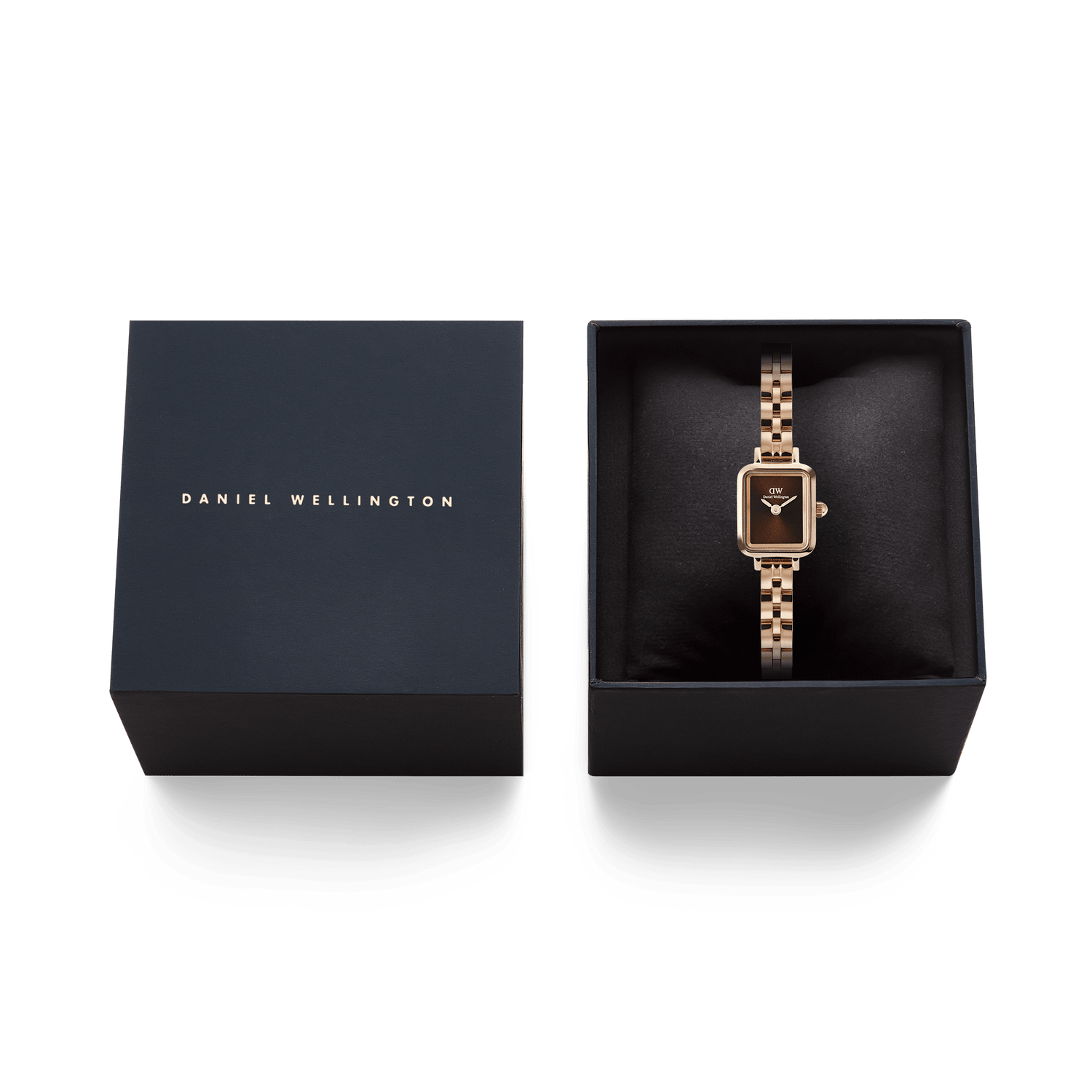 Quadro Mini Arch 3-link Amber Sunray Rose Gold watch presented in an elegant black Daniel Wellington gift box, highlighting its rectangular rose gold case and polished three-link bracelet.