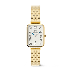 Rectangular gold Daniel Wellington women’s watch with a 5-link bracelet, white dial featuring bold Roman numerals, blue hands, a guilloché inner pattern, and a date window at 6 o’clock.
