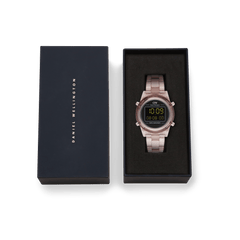 Retro Digital Dark Pink watch with a transparent pastel pink strap and black digital dial, presented in an elegant Daniel Wellington gift box.