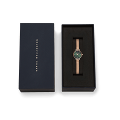 Petite Mini Emerald Melrose watch with an emerald green dial and rose gold mesh strap, elegantly presented in a black Daniel Wellington gift box.