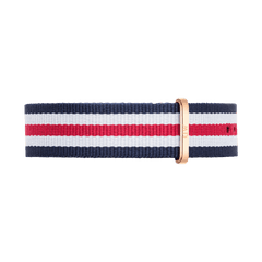 Navy blue, white, and red striped NATO watch strap with a rose gold buckle, crafted from durable polyester and designed for Daniel Wellington watches.