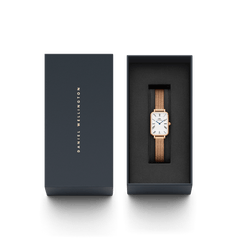 Quadro Roman Numerals Melrose rose gold rectangular watch with a mesh strap, presented in an elegant Daniel Wellington gift box.