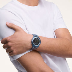 Person wearing the Retro Digital Light Blue watch, featuring a transparent blue case and strap with a black digital display, styled casually with a white T-shirt.