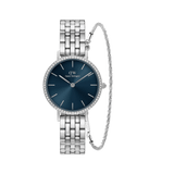 Silver stainless steel watch with a deep blue dial, sparkling bezel, and matching twisted bracelet, shown together as a coordinated gift set.