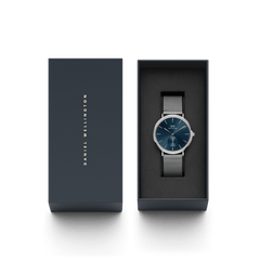 Classic Multi-Eye Sterling Arctic watch with a blue dial and silver mesh strap, presented in an elegant Daniel Wellington gift box.