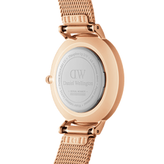 Back view of Petite Roman Numerals Melrose watch showing engraved case and rose gold mesh strap by Daniel Wellington.