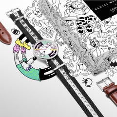 Steven Harrington x Daniel Wellington watch set featuring a multicolour printed dial with playful character artwork, black and white NATO strap, additional brown leather strap, and a gift box decorated with bold, illustrated designs.
