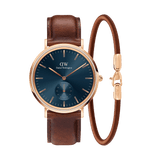 Daniel Wellington Classic Multi Eye St Mawes Arctic watch with a deep blue dial, rose gold case, and brown leather strap, paired with a matching slim rose gold and brown bracelet.