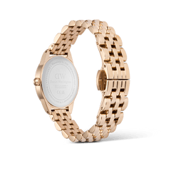 Rear view of the Ophelia Mini Emerald Rose Gold watch, showing the engraved stainless steel case back and polished rose gold beans link bracelet with butterfly clasp.
