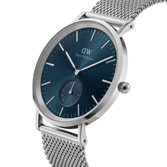 Daniel Wellington Classic Multi-Eye Sterling Arctic watch with a deep blue dial, minimalist silver hour markers, sub-dial, and a fine silver mesh strap.