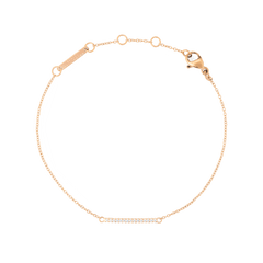 Rose gold chain bracelet featuring a slender adjustable band and a delicate bar set with white cubic zirconia crystals, offering a minimalist and elegant style.
