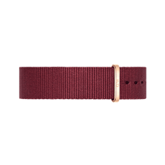 Ruby red polyester NATO watch strap featuring a sleek rose gold buckle and multiple adjustment holes, designed for Daniel Wellington watches.