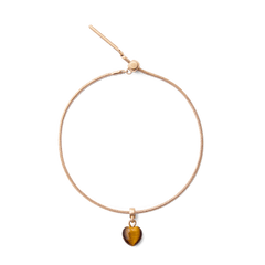 Rose gold bracelet featuring a heart-shaped tiger eye charm with golden-brown veining, designed for a refined and elegant look.