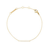 Delicate gold bracelet with an adjustable fine chain, featuring a slim bar set with white cubic zirconia crystals and a secure lobster clasp.