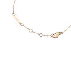 Adjustable gold chain bracelet clasp with multiple sizing rings and a Daniel Wellington engraved tag.