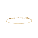 Slim gold flat chain bracelet with an adjustable clasp, crafted from stainless steel with a polished PVD gold finish.