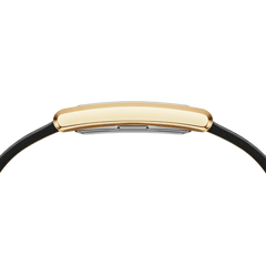 Side profile of the Bound Black Crocodile Gold watch, showing its slim rectangular gold case with a softly curved design and a black leather strap. The sleek silhouette highlights the watch’s refined and elegant craftsmanship.