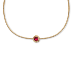 Gold necklace featuring a minimalist round charm with a vibrant red crystal set in a polished gold-tone stainless steel frame.