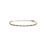 Gold tennis bracelet with a slim profile, featuring a row of honey-toned and clear Preciosa crystals set in 316L stainless steel with a PVD gold plated finish and an adjustable chain.