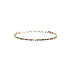 Gold tennis bracelet with a slim profile, featuring a row of honey-toned and clear Preciosa crystals set in 316L stainless steel with a PVD gold plated finish and an adjustable chain.