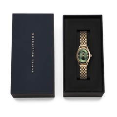 Daniel Wellington Ophelia Mini Emerald Gold watch with an oval emerald green dial and gold link bracelet, elegantly presented in a navy gift box with gold branding.
